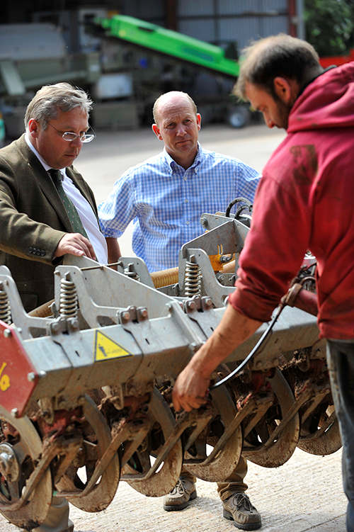 Person tending to machinery